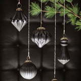 Gunmetal ornaments hanging from a tree
