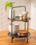 Black enamel metal tray stand on a counter