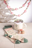 Holiday Cheer Holiday Mug & Sock Gift Box Set on a table