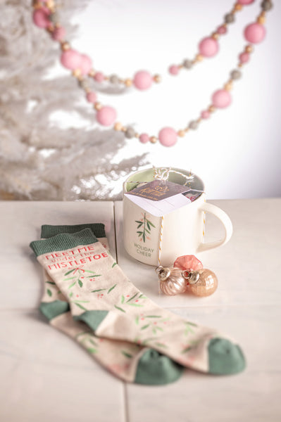 Holiday Cheer Holiday Mug & Sock Gift Box Set on a table
