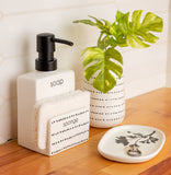 Milo Soap Dispenser With Sponge Holder on a table