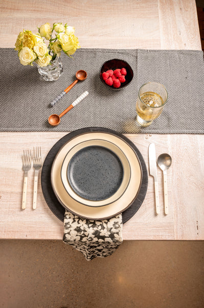 Kiki round appetizer plate with a dinner set up. 