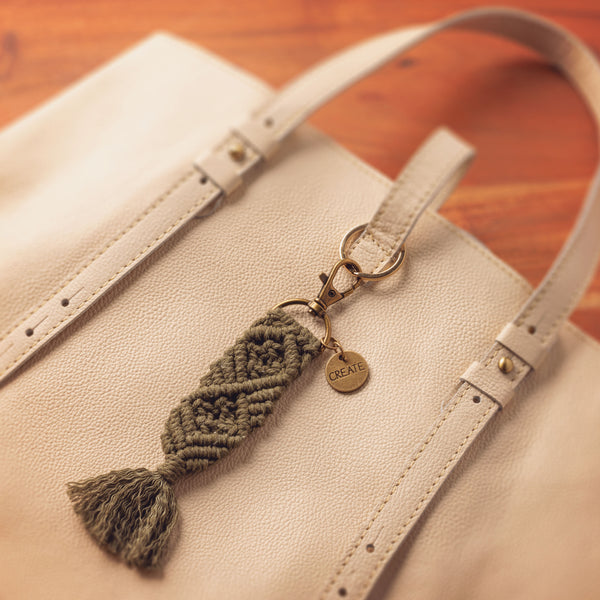 Create macrame keychain on a bag