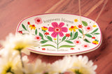 Happiness Blooms Oval Trinket Tray on a table