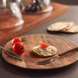Natural 8" wood plate with food on it