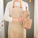 Woman holding the Montecito cutting boards