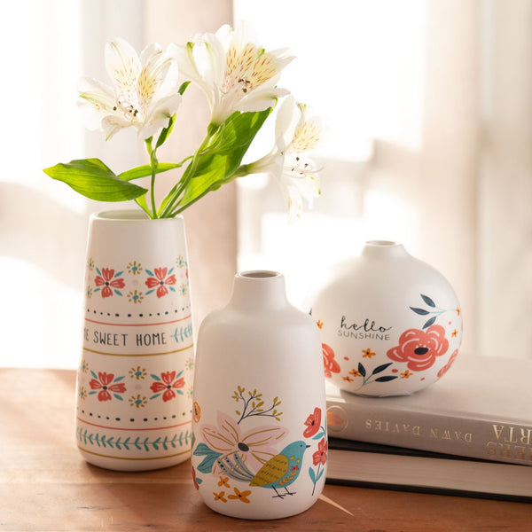 Small Bud Vases on a table with flowers