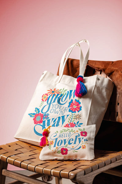Grow your own way canvas tote bag on a chair