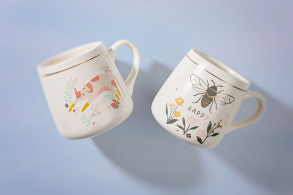 Bee and Cat Flora Mugs with light blue background
