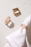 Rose quartz napkin ring on a white napkin