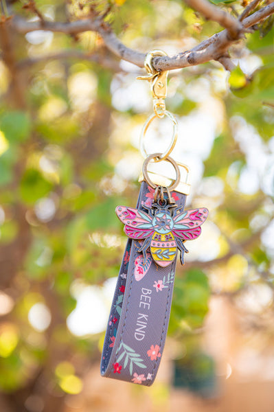 Bee new loop keychain hanging from tree branch