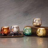 Mercury barrel votives on a table
