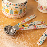 Ava measuring spoons on a counter