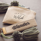 Wild canvas tassel card holder on a table 