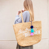 Women with daydream believer jute beach bag