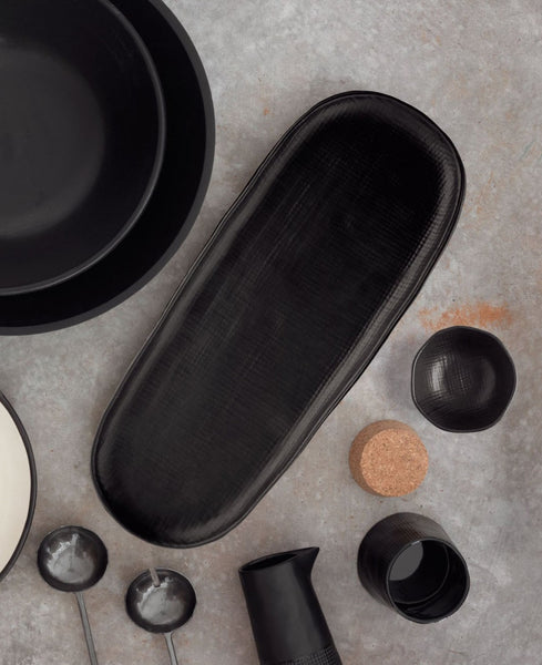 Black kiki platter/bowl set on a counter