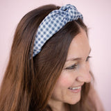 Women wearing gray gingham knot headbands 