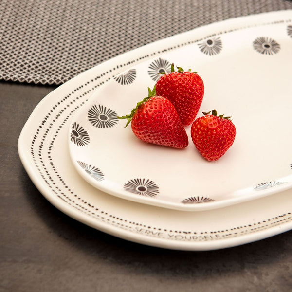 Large and small milo platters with strawberries