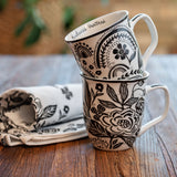 Boho mugs stacked on a table